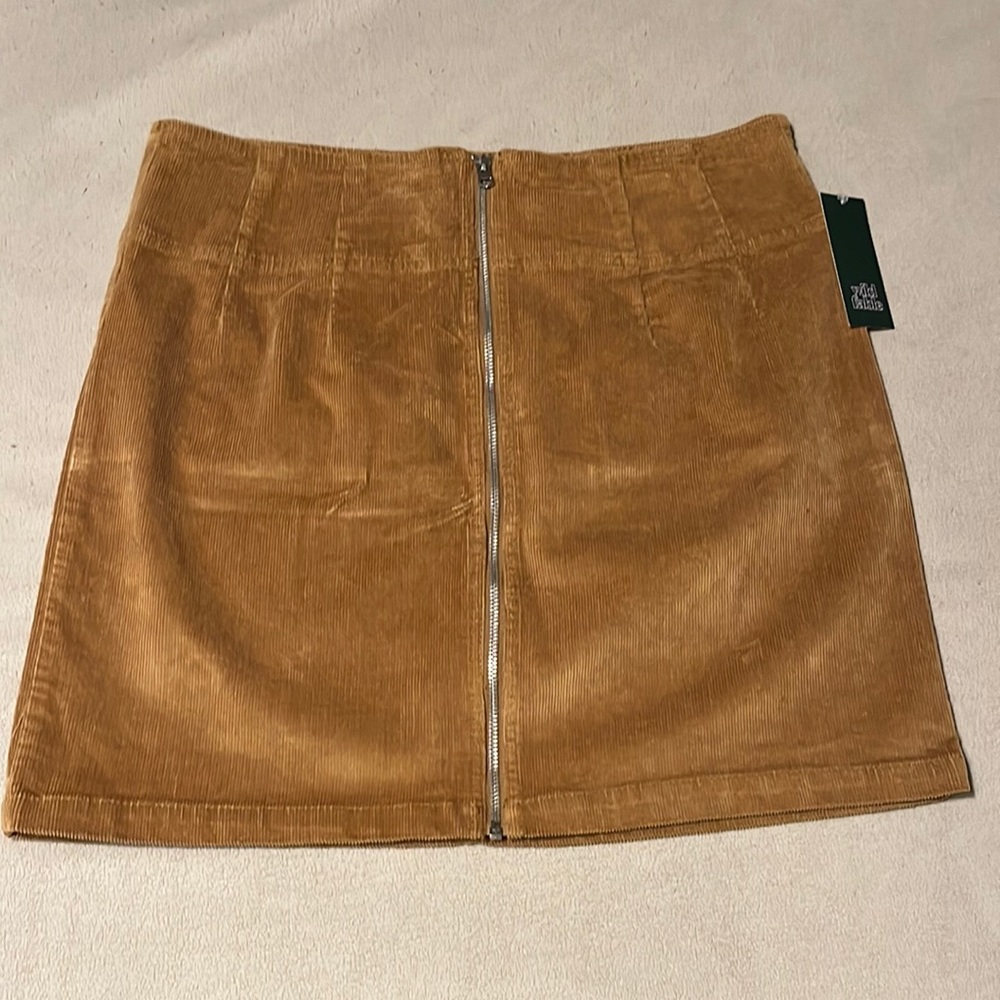 Corduroy zip front mini skirt.